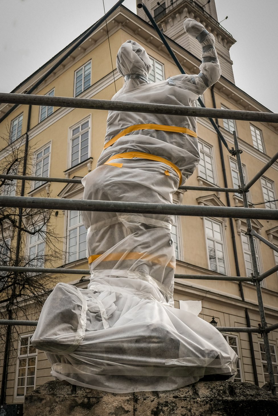 Greek gods and goddesses on fountains in Lviv's town square have been wrapped and scaffolded.