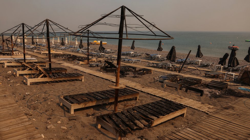 Sun loungers on a beach have been burned.