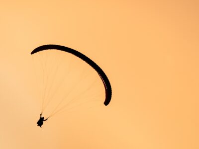 silhouette of paraglider tandem flying in orange s 2021 08 26 17 00 57 utc Гудаури Гудаури