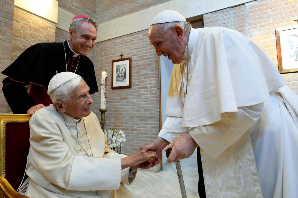 Benedict and Francis greeting each other at a meeting in the Vatican