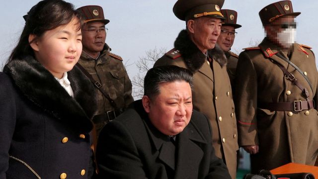 Kim Jong Un and his daughter Kim Ju Ae watch a missile test