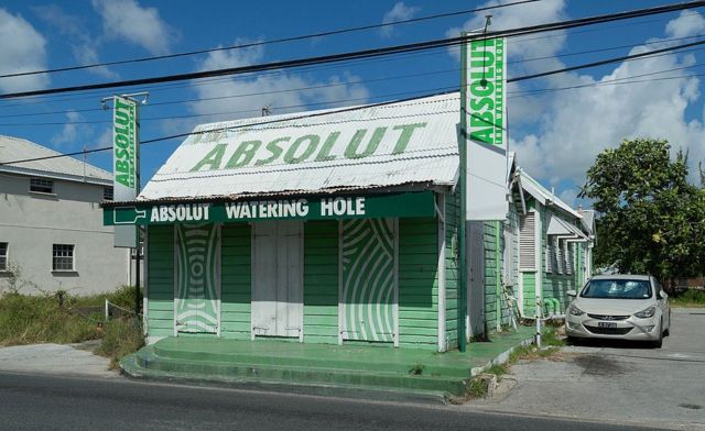Небольшой бар с рекламой водки Absolut
