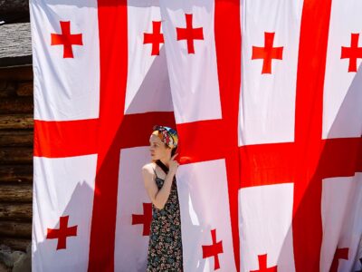summer a girl near three huge georgian flags 2022 11 15 23 30 03 utc общество общество